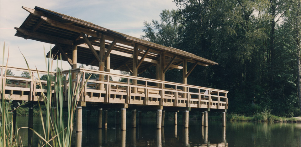 <p>Fishtrap Creek Park - Entry Pier - Abbotsford, BC</p><p>Fishtrap Creek Park is a stormwater retention area designed by Landscape Architect Catherine Berris. Within the park are 6 structures including an Entry Pier, Bridge, Reading Shelter, Picnic Shelter, Railway Observation Deck, and a Boardwalk. Completed in 1995.</p>